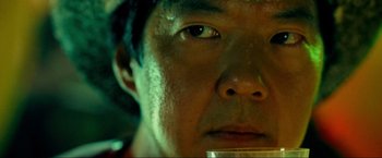 Movie still from “The Hangover Part III” (2013), directed by Todd Phillips – A man's face with a drink in his mouth; Extreme Close Up shot, Low angle