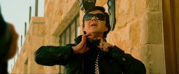 Movie still from “The Hangover Part III” (2013), directed by Todd Phillips – A man holding a camera up to his face; Close Up shot, Low angle