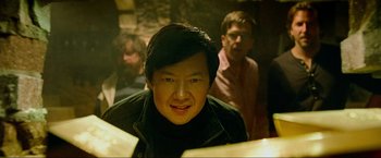 Movie still from “The Hangover Part III” (2013), directed by Todd Phillips – A man in a black jacket is looking at the camera; Close Up shot, Over the shoulder angle