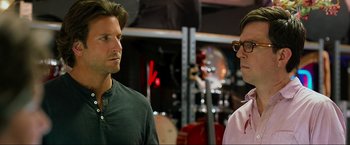 Movie still from “The Hangover Part III” (2013), directed by Todd Phillips – Two men standing next to each other in front of a microphone; Close Up shot, Over the shoulder angle