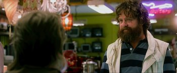 Movie still from “The Hangover Part III” (2013), directed by Todd Phillips – A man with a long beard talking to a woman; Close Up shot, Over the shoulder angle