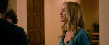 Movie still from “The Hangover Part III” (2013), directed by Todd Phillips – A beautiful blonde haired woman in a blue shirt; Close Up shot, Over the shoulder angle