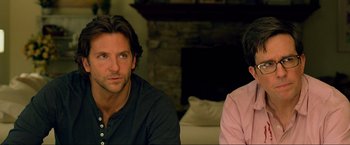 Movie still from “The Hangover Part III” (2013), directed by Todd Phillips – A man and a woman sitting next to each other in front of a fire place; Close Up shot, Over the shoulder angle