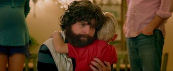 Movie still from “The Hangover Part III” (2013), directed by Todd Phillips – A man with a beard hugging a little boy; Close Up shot, Over the shoulder angle