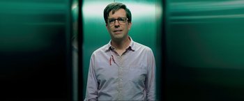 Movie still from “The Hangover Part III” (2013), directed by Todd Phillips – A man standing in front of a green wall; Close Up shot, Low angle