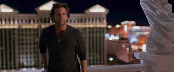 Movie still from “The Hangover Part III” (2013), directed by Todd Phillips – A man standing in front of a building at night; Close Up shot, Over the shoulder angle