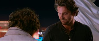 Movie still from “The Hangover Part III” (2013), directed by Todd Phillips – A man with long hair is talking to another man; Close Up shot, Over the shoulder angle