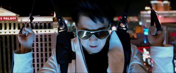 Movie still from “The Hangover Part III” (2013), directed by Todd Phillips – A man wearing sunglasses while sitting in a car; Close Up shot, Low angle