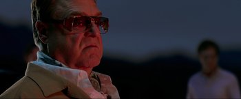 Movie still from “The Hangover Part III” (2013), directed by Todd Phillips – An older man wearing glasses looking at the camera; Close Up shot, Low angle