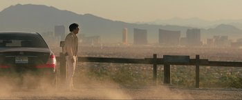 Movie still from “The Hangover Part III” (2013), directed by Todd Phillips – A man standing on top of a dirt hill; Extreme Wide shot, Low angle