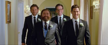 Movie still from “The Hangover Part III” (2013), directed by Todd Phillips – A group of men standing next to each other in tuxedos; Medium shot, Low angle