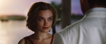 Movie still from “Death on the Nile” (2022), directed by Kenneth Branagh – A person wearing a dress; Close Up shot, Over the shoulder angle