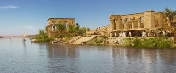 Movie still from “Death on the Nile” (2022), directed by Kenneth Branagh – A group of people standing around a body of water; Extreme Wide shot, High angle