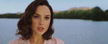 Movie still from “Death on the Nile” (2022), directed by Kenneth Branagh – A person near a body of water; Close Up shot, Over the shoulder angle