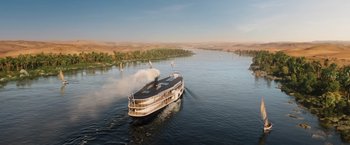 Movie still from “Death on the Nile” (2022), directed by Kenneth Branagh – A boat traveling down a large body of water; Extreme Wide shot, High angle