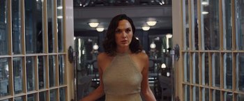 Movie still from “Death on the Nile” (2022), directed by Kenneth Branagh – Gal gadot as wonder woman in a scene from the movie; Medium shot, Over the shoulder angle