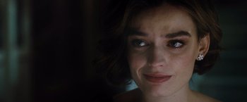 Movie still from “Death on the Nile” (2022), directed by Kenneth Branagh – A woman's face in the dark; Close Up shot, Over the shoulder angle