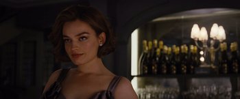 Movie still from “Death on the Nile” (2022), directed by Kenneth Branagh – A person wearing a dress; Close Up shot, Over the shoulder angle