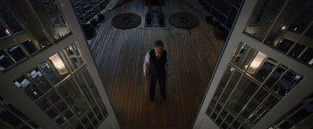 Movie still from “Death on the Nile” (2022), directed by Kenneth Branagh – A man standing on the deck of a boat; Wide shot, High angle