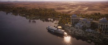 Movie still from “Death on the Nile” (2022), directed by Kenneth Branagh – An aerial view of a boat in the middle of a lake; Extreme Wide shot, High angle