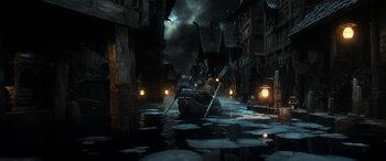 Movie still from “The Hobbit: The Battle of the Five Armies” (2014), directed by Peter Jackson – A boat in the middle of the water; Wide shot, High angle