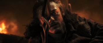 Movie still from “The Hobbit: The Battle of the Five Armies” (2014), directed by Peter Jackson – A person with a beard; Close Up shot, Over the shoulder angle