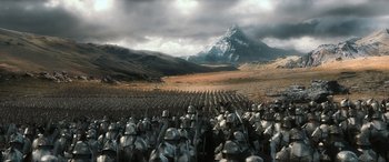 Movie still from “The Hobbit: The Battle of the Five Armies” (2014), directed by Peter Jackson – A large group of people are standing in a field; Extreme Wide shot, High angle