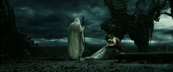 Movie still from “The Hobbit: The Battle of the Five Armies” (2014), directed by Peter Jackson – A man in a white robe and a woman in a white dress; Wide shot, Over the shoulder angle