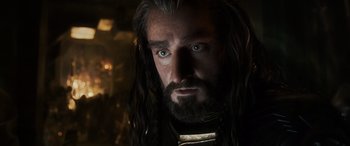 Movie still from “The Hobbit: The Battle of the Five Armies” (2014), directed by Peter Jackson – Thorin oakenshield with long hair; Close Up shot, Low angle