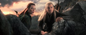 Movie still from “The Hobbit: The Battle of the Five Armies” (2014), directed by Peter Jackson – Two people are standing next to each other on a cliff; Medium shot, Low angle
