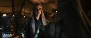 Movie still from “The Hobbit: The Battle of the Five Armies” (2014), directed by Peter Jackson – A man with long blonde hair wearing a crown; Close Up shot, Over the shoulder angle