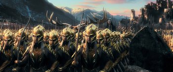 Movie still from “The Hobbit: The Battle of the Five Armies” (2014), directed by Peter Jackson – A group of men in gold and black armor; Extreme Wide shot, High angle