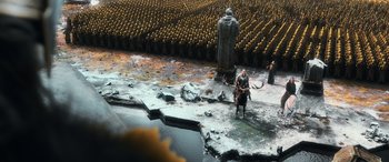Movie still from “The Hobbit: The Battle of the Five Armies” (2014), directed by Peter Jackson – A group of people standing in the middle of a field; Extreme Wide shot, High angle