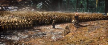 Movie still from “The Hobbit: The Battle of the Five Armies” (2014), directed by Peter Jackson – A large crowd of people are gathered in the middle of a field; Extreme Wide shot, High angle