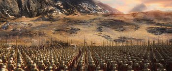 Movie still from “The Hobbit: The Battle of the Five Armies” (2014), directed by Peter Jackson – A large crowd of people are standing in a field; Extreme Wide shot, High angle