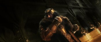 Movie still from “The Hobbit: The Battle of the Five Armies” (2014), directed by Peter Jackson – A man dressed in a costume and holding a sword; Medium shot, Low angle