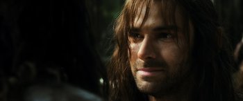 Movie still from “The Hobbit: The Battle of the Five Armies” (2014), directed by Peter Jackson – A person with long hair; Close Up shot, Over the shoulder angle