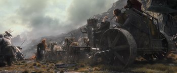 Movie still from “The Hobbit: The Battle of the Five Armies” (2014), directed by Peter Jackson – An image of a man riding a horse drawn carriage in the wilderness; Wide shot, Low angle