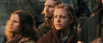 Movie still from “The Hobbit: The Battle of the Five Armies” (2014), directed by Peter Jackson – A man and a woman sitting next to each other; Close Up shot, Low angle