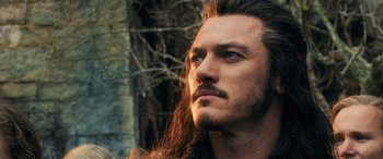 Movie still from “The Hobbit: The Battle of the Five Armies” (2014), directed by Peter Jackson – A person with long hair; Close Up shot, Low angle