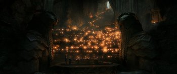 Movie still from “The Hobbit: The Battle of the Five Armies” (2014), directed by Peter Jackson – A group of people standing in front of candles; Extreme Wide shot, High angle