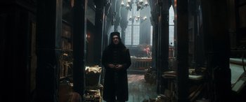 Movie still from “The Hobbit: The Desolation of Smaug” (2013), directed by Peter Jackson – A man standing in the middle of a room; Wide shot, Low angle