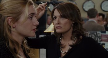 Movie still from “The Holiday” (2006), directed by Nancy Meyers – A woman is putting lipstick on another woman's face; Close Up shot, Over the shoulder angle
