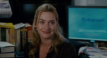 Movie still from “The Holiday” (2006), directed by Nancy Meyers – A person sitting in front of a computer; Close Up shot, Over the shoulder angle