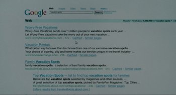 Movie still from “The Holiday” (2006), directed by Nancy Meyers – A computer screen showing a search for vacation spots; Extreme Close Up shot, High angle