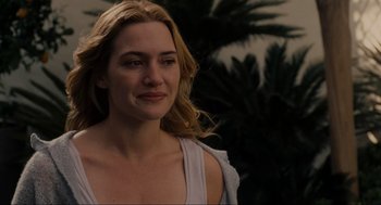 Movie still from “The Holiday” (2006), directed by Nancy Meyers – A woman with long blonde hair is looking at the camera; Close Up shot, Over the shoulder angle