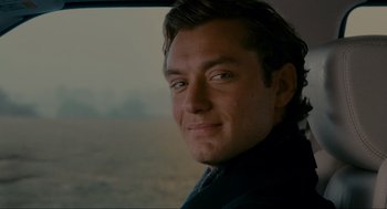Movie still from “The Holiday” (2006), directed by Nancy Meyers – A man's face as he looks out a window; Close Up shot, Over the shoulder angle