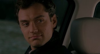 Movie still from “The Holiday” (2006), directed by Nancy Meyers – A person sitting in a car; Close Up shot, Over the shoulder angle
