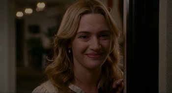 Movie still from “The Holiday” (2006), directed by Nancy Meyers – A person with long blonde hair; Close Up shot, Over the shoulder angle