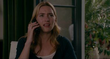 Movie still from “The Holiday” (2006), directed by Nancy Meyers – A person talking on a cell phone; Close Up shot, Over the shoulder angle